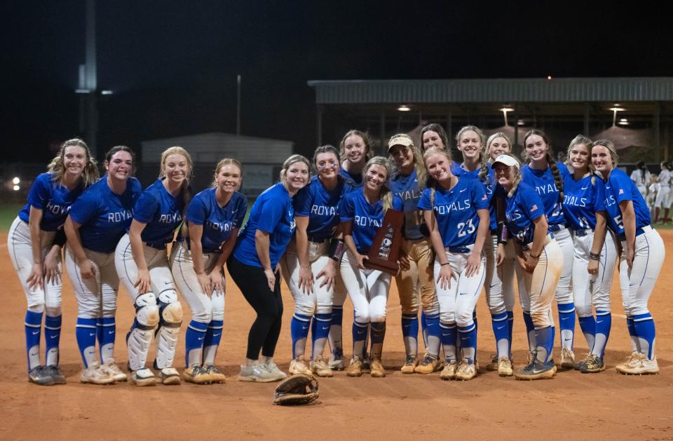 The Royals pose with the trophy after their 7-6 victory in the Jay vs Northview District 1-1A championship softball game at Central High School in Milton on Thursday, May 2, 2024.