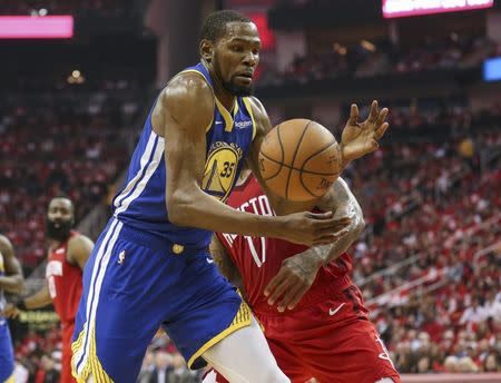 May 6, 2019; Houston, TX, USA; Golden State Warriors forward Kevin Durant (35) controls the ball as Houston Rockets forward PJ Tucker (17) defends during the second quarter in game four of the second round of the 2019 NBA Playoffs at Toyota Center. Mandatory Credit: Troy Taormina-USA TODAY Sports