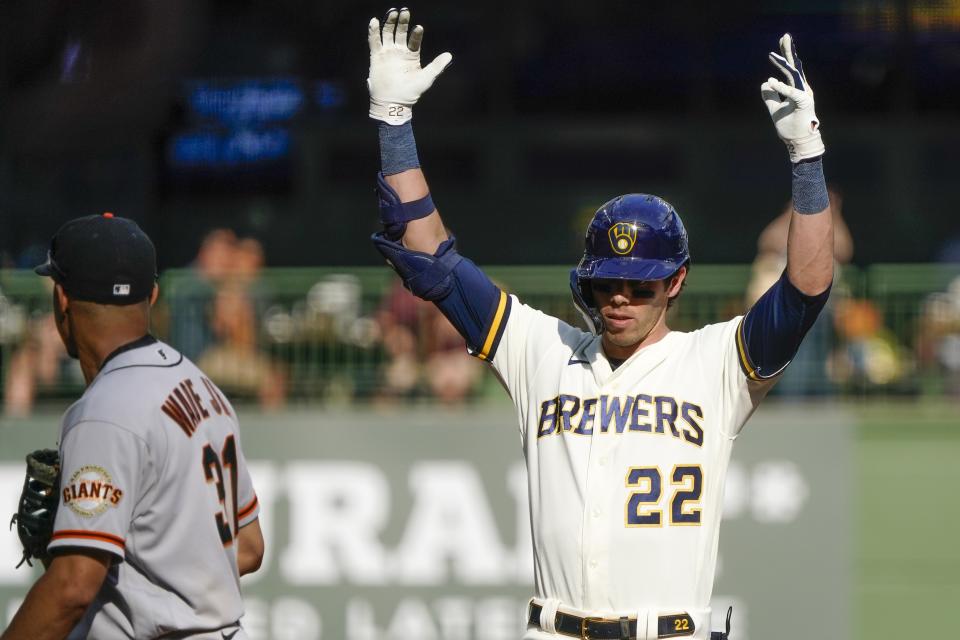 Milwaukee Brewers' Christian Yelich reacts after hitting an RBI double during the fourth inning of game 1 of a doubleheader baseball game against the San Francisco Giants Thursday, Sept. 8, 2022, in Milwaukee. (AP Photo/Morry Gash)