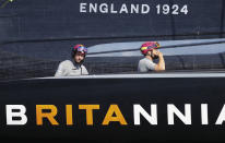 Ben Ainslie, left, skipper on Britain's INEOS Team UK races Italy's Luna Rossa to win race six of the Prada Cup on Auckland's Waitemata Harbour, New Zealand, Saturday, Feb.20, 2021. (Dean Purcell/NZ Herald via AP)