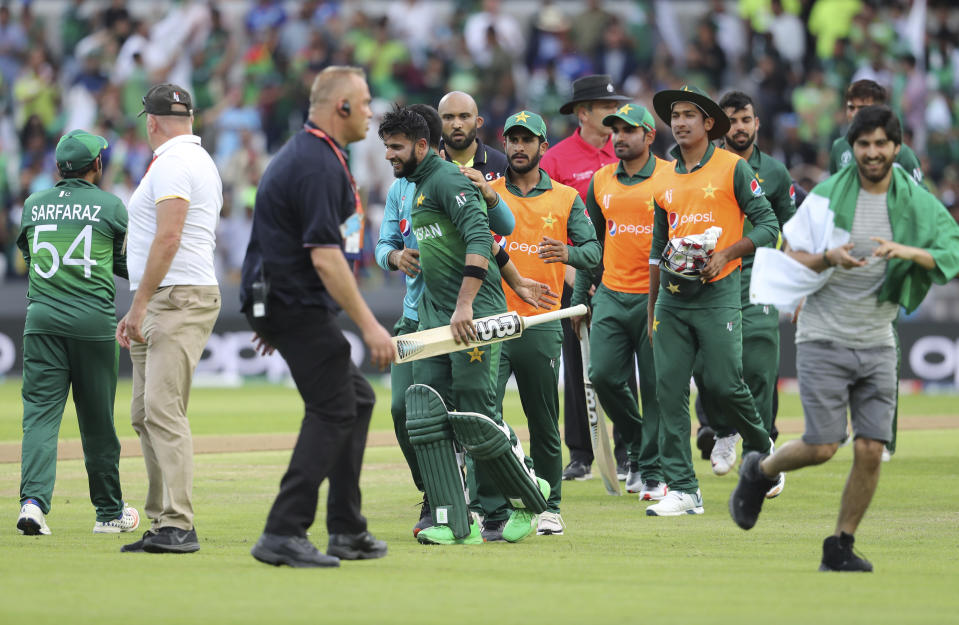 Pakistani cricketers celebrate their team's victory in the Cricket World Cup match between Pakistan and Afghanistan at Headingley in Leeds, England, Saturday, June 29, 2019. (AP Photo/Rui Vieira)