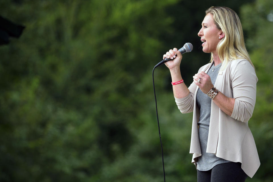 FILE - In this Sept. 19, 2020 file photo, Marjorie Taylor Greene speaks during a second amendment rally at the Northwest Georgia Amphitheatre in Ringgold, Ga. Republican Sen. Kelly Loeffler, of Georgia, enthusiastically accepted an endorsement Thursday, Oct. 15 from Taylor Greene, a congressional candidate who embraced QAnon conspiracy theories and espoused racist views in a series of online videos. (C.B. Schmelter/Chattanooga Times Free Press via AP, File)