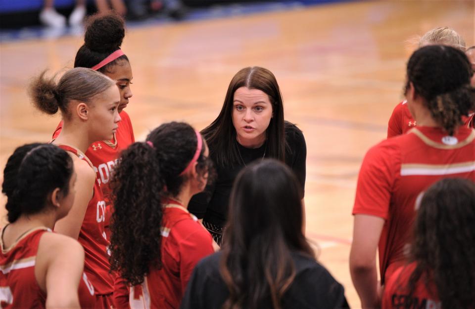 Lubbock Coronado coach Ashley James talks to her team after a timeout during her team's game against Cooper. Coronado beat the Lady Coogs 49-38 in the District 4-5A game Tuesday, Jan. 18, 2022, at Cougar Gym in Abilene.