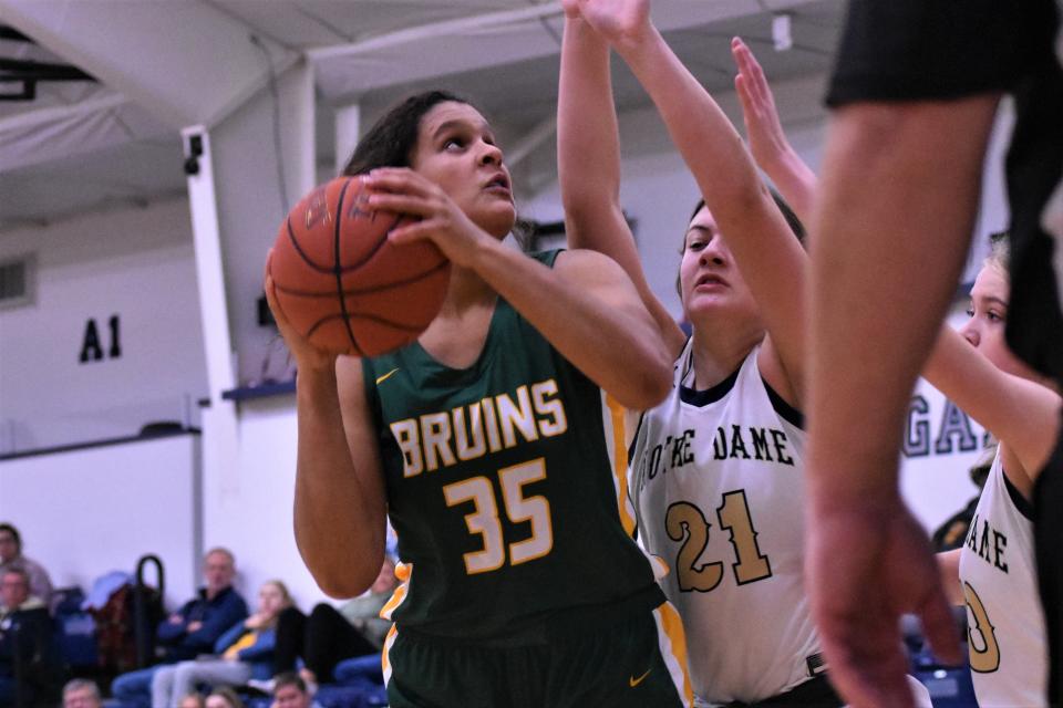 Rock Bridge's Jayda Porter (35) battles the Quincy Notre Dame defense during the Sophie Cunningham Classic on Dec. 4, 2022, at Columbia, Mo.