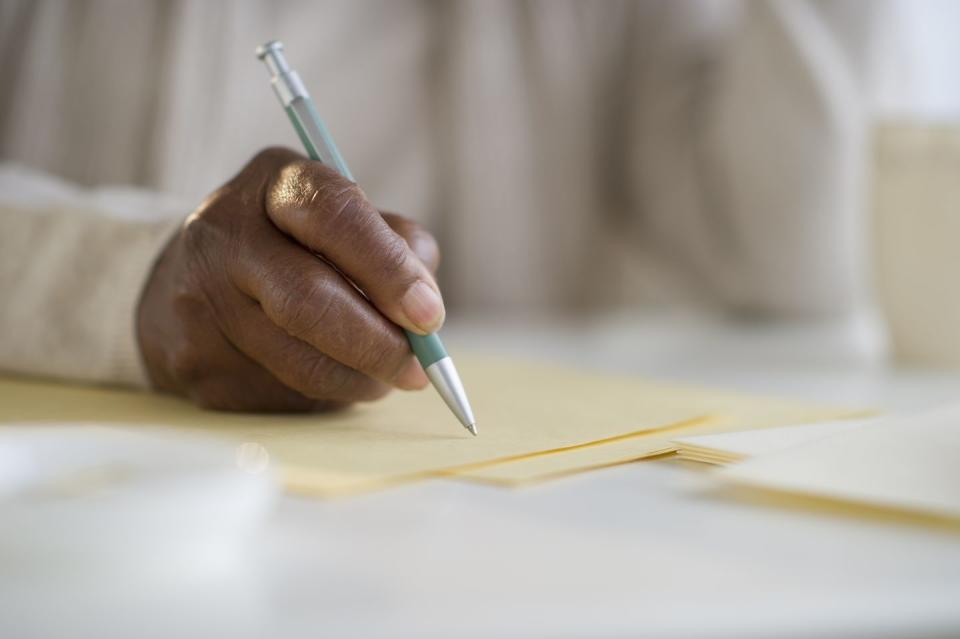 black woman writing letter