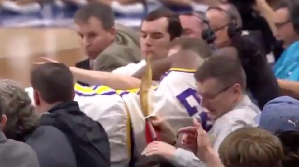 LSU's Emmitt Williams flew over the scorer's table trying to save a loose ball. (Screenshot: TruTV)