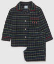 <p>Follow Prince George’s lead in cute and cozy tartan from Trotters. The future monarch wore tartan trousers from the royal-approved brand in official pictures with the Queen last Christmas. Now little ones can get a similar look with these soft, brushed cotton pajamas complete with marching Guardsmen. </p> <p><strong>Buy it! Trotters Guardsman Pyjamas, $68; <a href="https://www.trotters.co.uk/products/guardsman-pyjamas?currency=USD" rel="sponsored noopener" target="_blank" data-ylk="slk:trotters.co.uk;elm:context_link;itc:0;sec:content-canvas" class="link ">trotters.co.uk</a></strong></p>