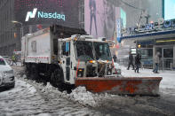 <p>A sanitation truck plows the streets in Times Square, Feb. 9, 2017, during a winter storm in New York. A powerful, fast-moving storm swept through the northeastern U.S. Thursday, making for a slippery morning commute and leaving some residents bracing for blizzard conditions. (Photo: Gordon Donovan/Yahoo News) </p>