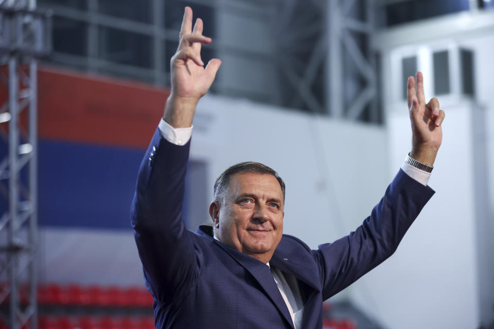 Serb member of the Bosnian Presidency Milorad Dodik, who is running for the President of Republika Srpska, waves with three fingers during campaign rally of Alliance of Independent Social Democrats (SNSD) in Istocno Sarajevo, Bosnia, Tuesday, Sept. 27, 2022. Bosnia's upcoming general election could be about the fight against corruption and helping its ailing economy. But at the time when Russia has a strong incentive to reignite conflict in the small Balkan nation, the Oct 2. vote appears set to be an easy test for long-entrenched nationalists who have enriched cronies and ignored the needs of the people. (AP Photo/Armin Durgut)