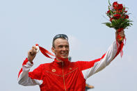 BEIJING - AUGUST 19: Silver medalist Simon Whitfield of Canada poses after the Mens Triathlon Final at the Triathlon Venue on Day 11 of the Beijing 2008 Olympic Games on August 19, 2008 in Beijing, China. (Photo by Shaun Botterill/Getty Images)