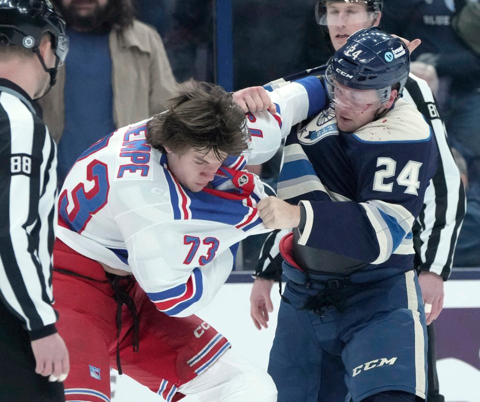 Feb. 25, 2024; Columbus, Ohio, USA; 
Columbus Blue Jackets right wing Mathieu Olivier (24) and New York Rangers center Matt Rempe (73) fight during the first period of an NHL game at Nationwide Arena on Sunday.