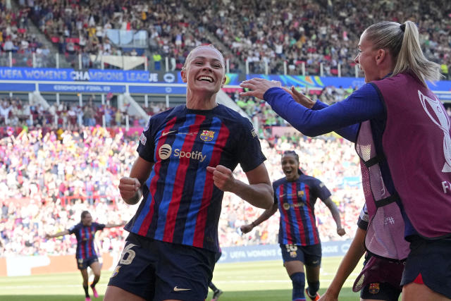 Barcelona&#39;s Fridolina Rolfo, center, celebrates after scoring her side&#39;s third goal during the Women&#39;s Champions League final soccer match between FC Barcelona and VfL Wolfsburg at the PSV Stadion in Eindhoven, Netherlands, Saturday, June 3, 2023. (AP Photo/Martin Meissner)