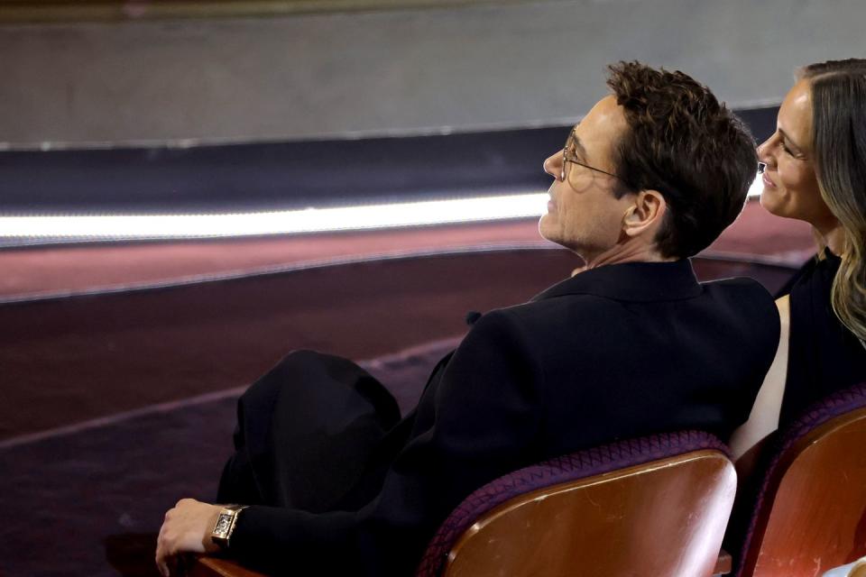 robert downey jr seated during the oscars ceremony