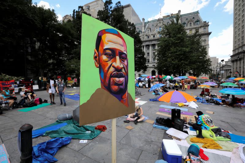 Demonstrators protest to defund police at area they are calling "City Hall Autonomous Zone" in lower Manhattan in New York