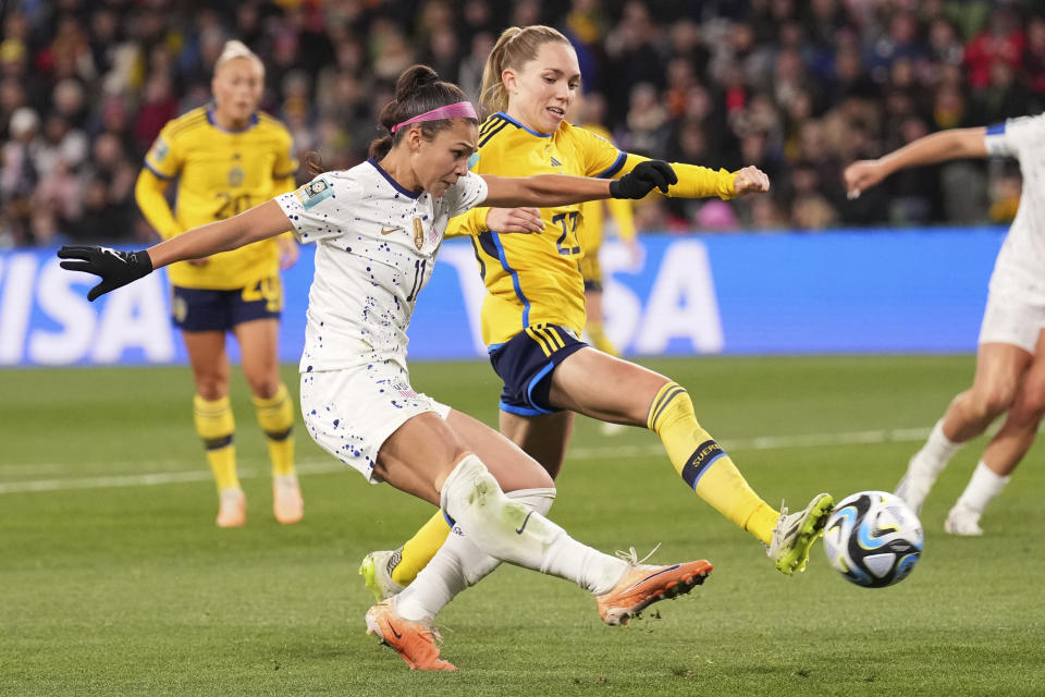 United States' Sophia Smith, left, takes a shot at goal during the Women's World Cup round of 16 soccer match between Sweden and the United States in Melbourne, Australia, Sunday, Aug. 6, 2023. (AP Photo/Scott Barbour)