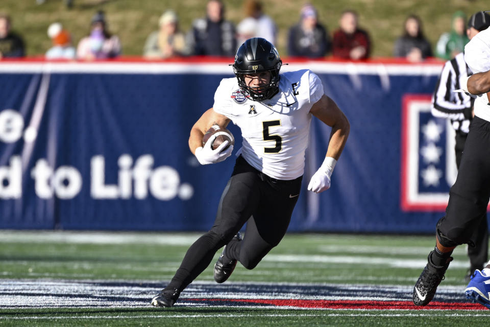 UCF running back Isaiah Bowser (5) runs the ball during the first half of the Military Bowl NCAA college football game against Duke, Wednesday, Dec. 28, 2022, in Annapolis, Md. (AP Photo/Terrance Williams)