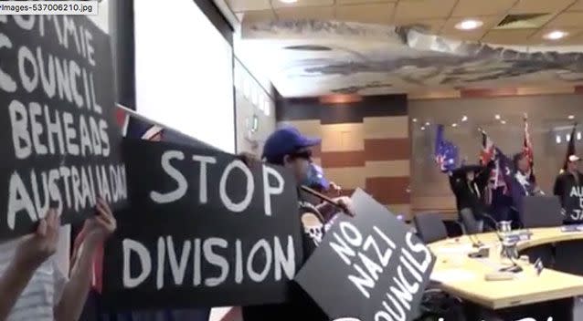 Several protesters, called Patriot Blue, held neo-Nazi signs as they arrived at Moreland City Council on Wednesday. Photo: Facebook