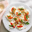 <div class="caption-credit"> Photo by: Lisa Romerein</div><div class="caption-title">Goat Cheese with Peppers and Almonds</div><b>Goat Cheese with Peppers and Almonds</b> <br> Just slice and serve a few refined ingredients and you're ready to mingle. <br> <b>Pair with:</b> Sparkling rosé, Pinot Grigio, Riesling, or Pinot Noir <br> <b>Recipe:</b> <br> Ingredients <br> <ul> <li>8 ounces log fresh goat cheese (chevre) </li> <li>5 Peppadew peppers*, cut in half and thinly sliced </li> <li>20 Marcona almonds </li> <li>1 tablespoon fresh oregano leaves </li> <li>3 tablespoons extra-virgin olive oil, for drizzling </li> <li>Crackers </li> </ul>Preparation <br> Slice cheese into rounds about 1/2 in. thick, dipping the knife into hot water between slices and wiping it clean. Arrange slices on a plate and sprinkle with peppers, almonds, and oregano leaves. Drizzle with olive oil and serve with crackers. <br> *Find in the olive bar at well-stocked grocery stores. <br>