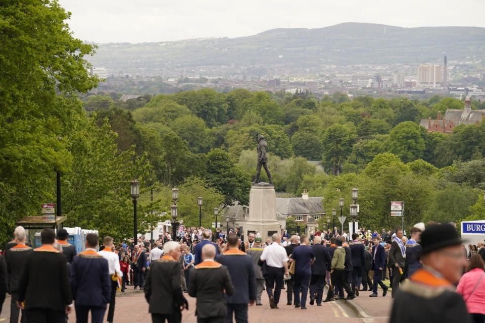 Orangemen file past the statue of Sir Edward Carson (Niall Carson/PA) (PA Wire)