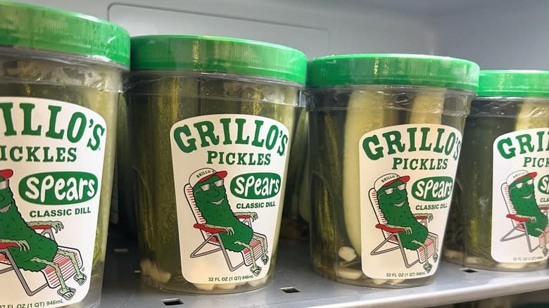 Grillo's pickle containers on shelf