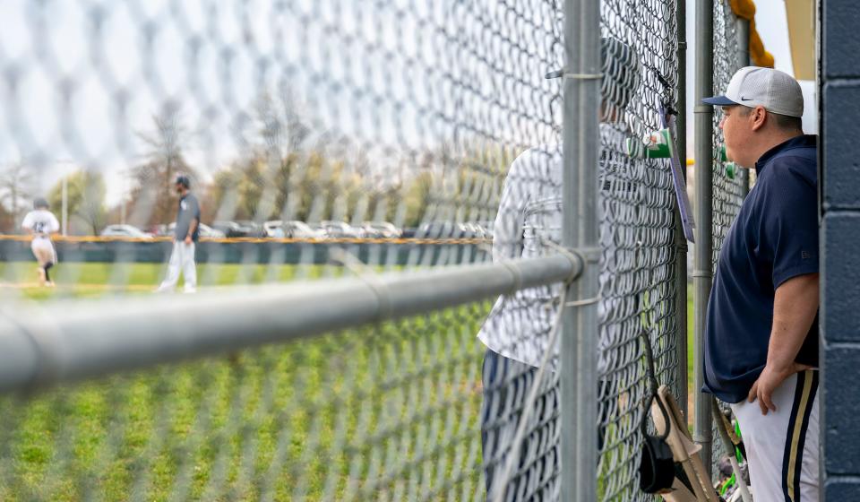 Council Rock South's TJ Farrell coaches the JV baseball team from the dugout during an April 10 game against Council Rock North in Holland.