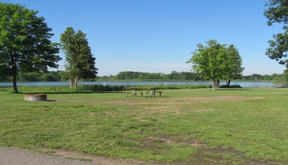 Campsite 130 at Brighton Recreation Area's Bishop Lake Campground.