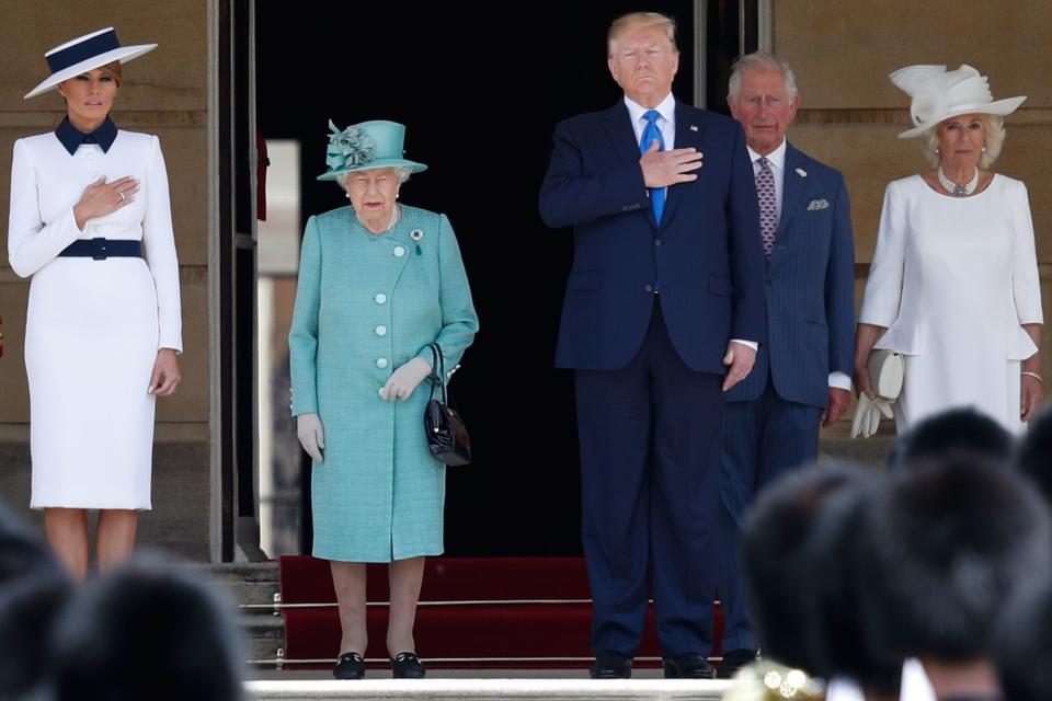 (L-R) US First Lady Melania Trump, Britain's Queen Elizabeth II, US President Donald Trump, Britain's Prince Charles, Prince of Wales and Britain's Camilla, Duchess of Cornwall stand on the steps as the US national anthem plays during a welcome ceremony at Buckingham Palace in central London on June 3, 2019, on the first day of the US president and First Lady's three-day State Visit to the UK. - Britain rolled out the red carpet for US President Donald Trump on June 3 as he arrived in Britain for a state visit already overshadowed by his outspoken remarks on Brexit. (Photo by Adrian DENNIS / AFP)        (Photo credit should read ADRIAN DENNIS/AFP/Getty Images)