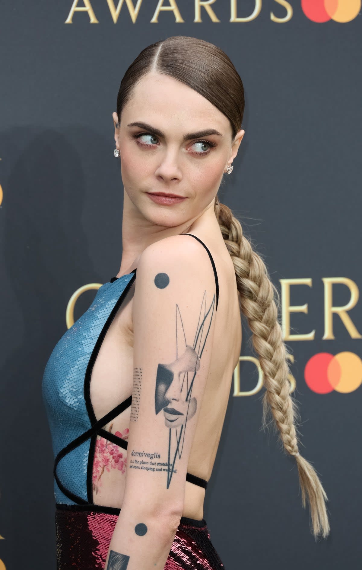 Delevingne appears to have added a thicker line to an existing tattoo above to cover up the typo in ‘walking’ (Getty Images)