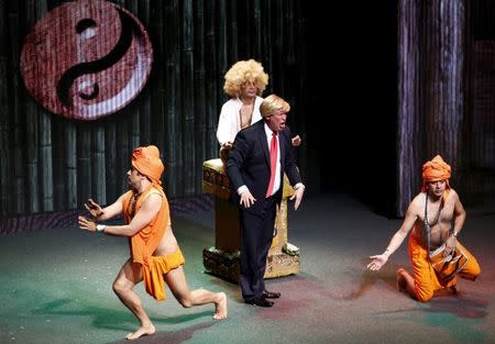 Mexican comics, one of them dressed as U.S. Republican presidential candidate Donald Trump (front C), poke fun at the candidate during the show entitled "Sons of Trump" at the Aldana theater in Mexico City, Mexico October 3, 2015. REUTERS/Henry Romero