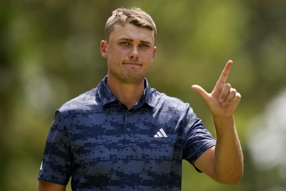 Ludvig Aberg, of Sweden, waves after making a putt on the fifth hole during the first round of the U.S. Open golf tournament Thursday, June 13, 2024, in Pinehurst, N.C. (AP Photo/George Walker IV)