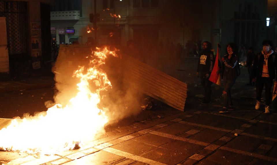 Protesters against the reelection of President Evo Morales build a burning barricade, in La Paz, Bolivia, Thursday, Oct. 31, 2019. Violence has escalated since Morales was declared the winner of the Oct. 20 vote amid delays in the vote count. The opposition alleges the outcome was rigged to give Morales enough of a majority to avoid a runoff election; the president denies any irregularities. (AP Photo/Juan Karita)