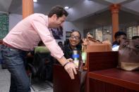 Co-founder of the Jumia company, Hodara speaks with one of the staff at the Jumia office in Lagos