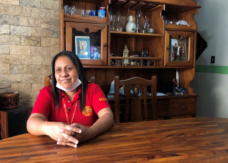 Hospital security guard Diaz talks at her home in Caracas