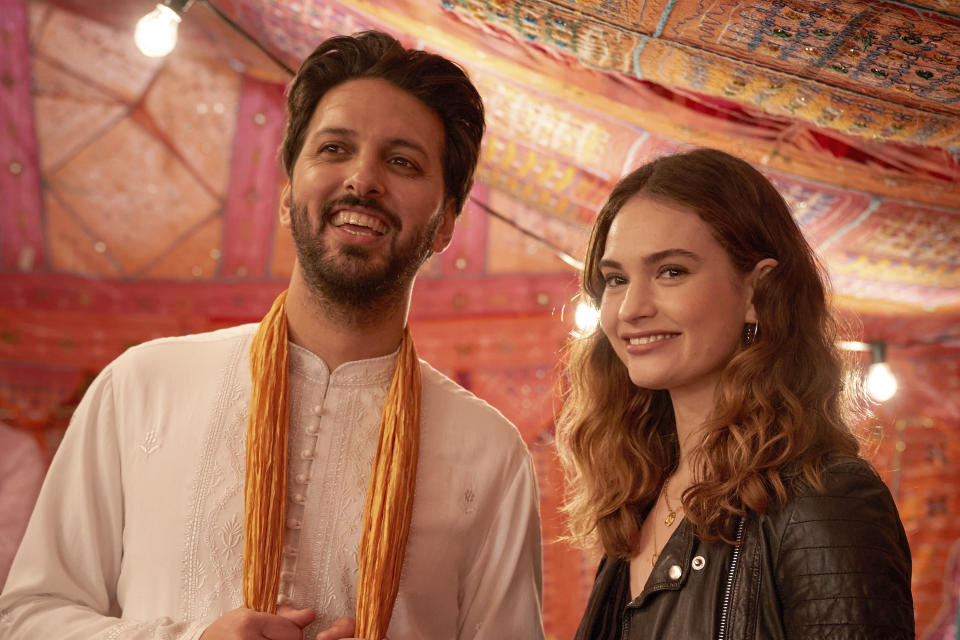 This image released by Shout! Studios shows Shazad Latif, left, and Lily James in a scene from "What's Love Got to Do With It." (Robert Viglasky/Shout! Studios via AP)