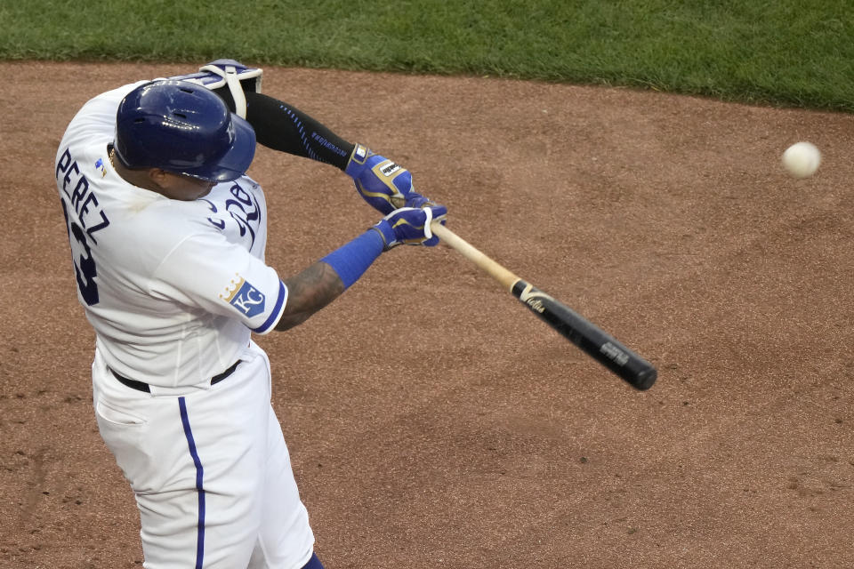 Kansas City Royals' Salvador Perez hits a one run sacrifice fly during the fourth inning of a baseball game against the Detroit Tigers Tuesday, May 23, 2023, in Kansas City, Mo. (AP Photo/Charlie Riedel)