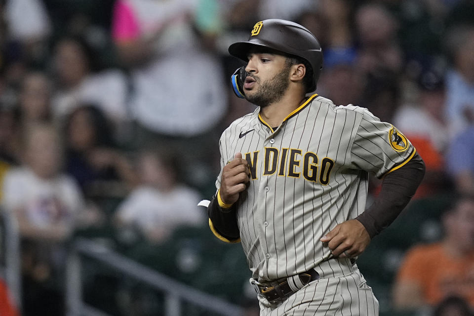 San Diego Padres' Trent Grisham runs the bases after hitting a three-run home run during the eighth inning of a baseball game against the Houston Astros, Friday, Sept. 8, 2023, in Houston. (AP Photo/Kevin M. Cox)