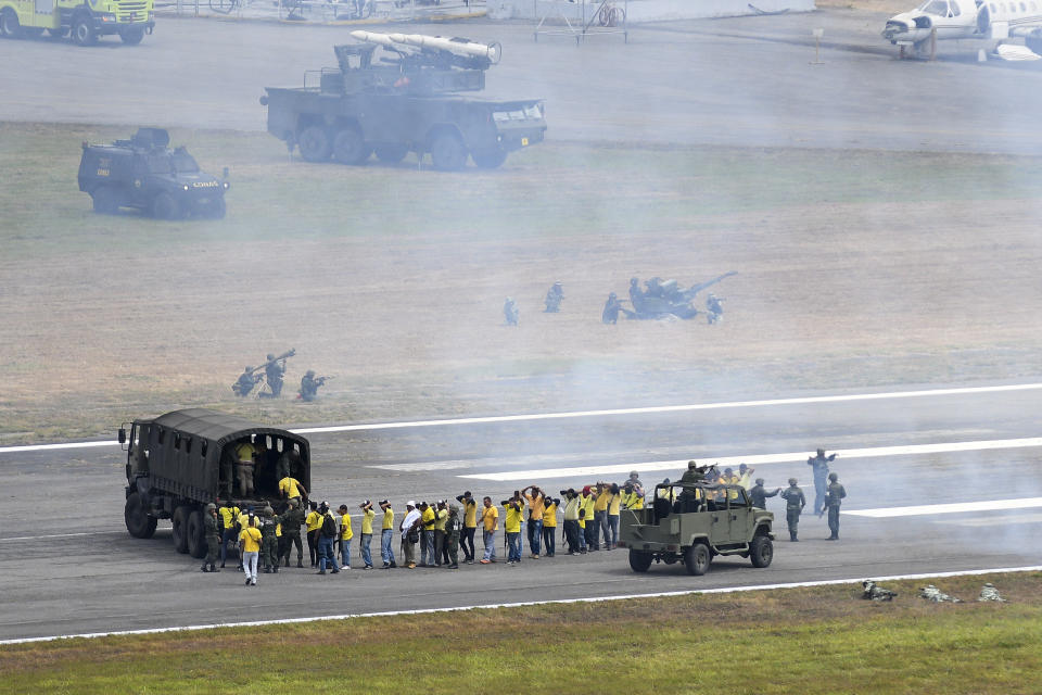 A military drill at La Carlota airbase in Caracas, Venezuela, Saturday, Feb. 15, 2020. Venezuela's President Nicolas Maduro ordered two days of nationwide military exercises, including participation of civilian militias. (AP Photo/Matias Delacroix)