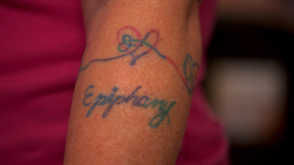 Russell has an "Epiphany" tattoo as a tribute both to the BTS song of the same name and her own life-changing moment.