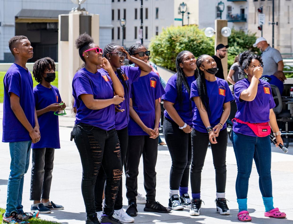 Ashley Jordan, producer of the Black Arts MKE Youth Performing Arts Camp and camp students watch a short film they created on Friday, July 29, 2022 at the Peck Pavilion.