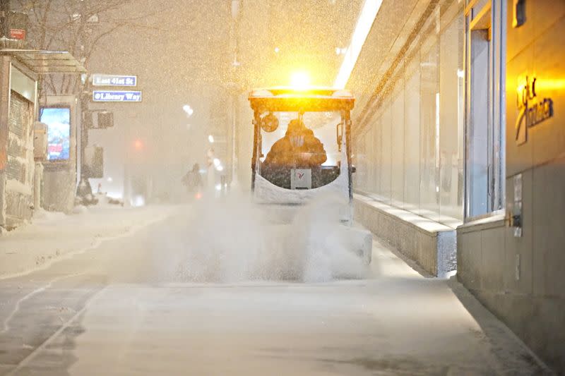 Snow begins to fall in Bryant park during a Nor'easter, in New York City