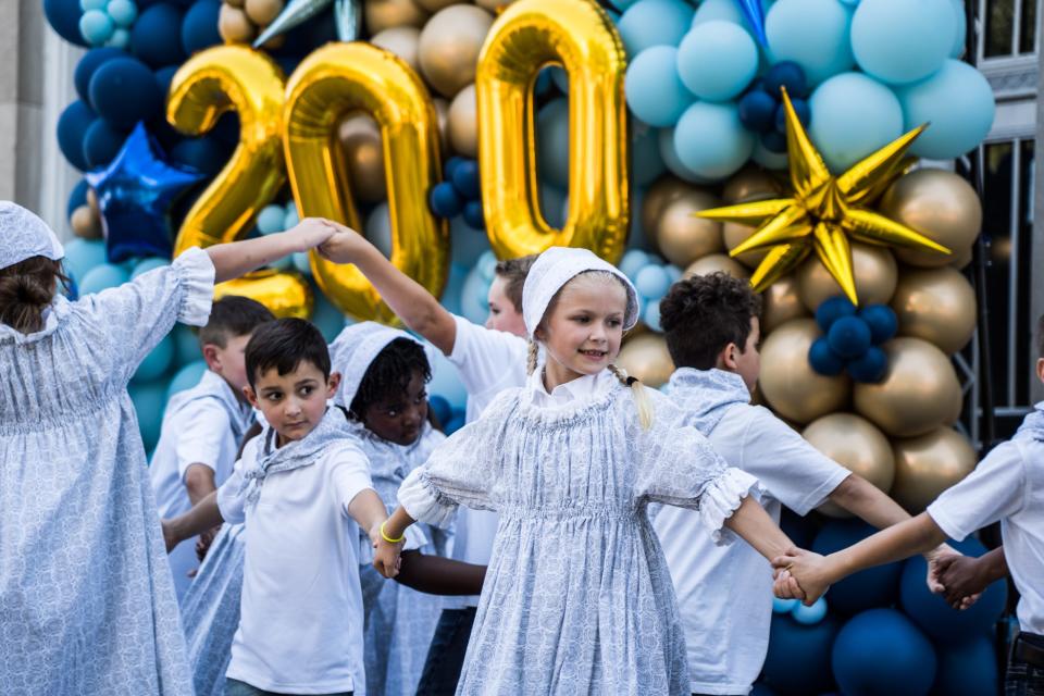 Children participate in a dance Saturday during Terrebonne Parish's bicentennial festival in Houma's Courthouse Square.