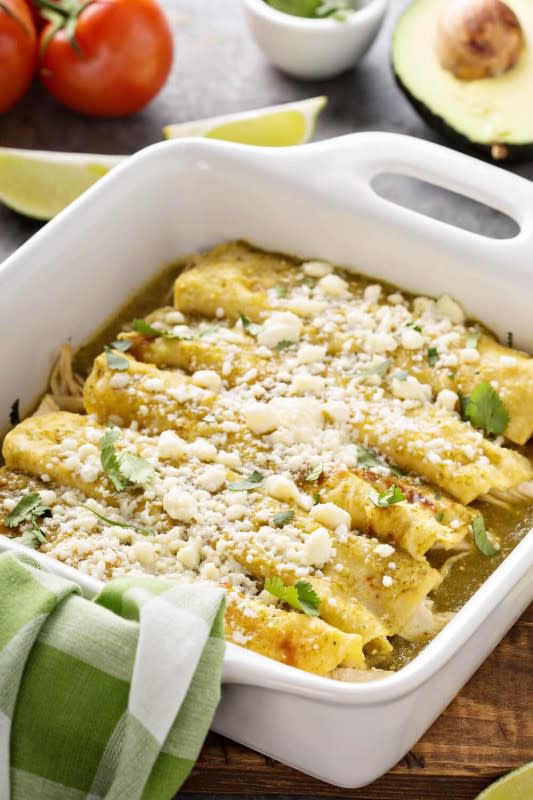 <p>Maven Cookery</p><p>Enchiladas Verdes is a combination of chicken, salsa verde and a shredded Mexican cheese blend which is wrapped in flour tortillas and baked.</p><p><strong>Get the recipe: <a href="https://mavencookery.com/enchiladas-verdes/" rel="nofollow noopener" target="_blank" data-ylk="slk:Easy Enchiladas Verdes;elm:context_link;itc:0;sec:content-canvas" class="link rapid-noclick-resp"><em>Easy Enchiladas Verdes</em></a></strong></p>