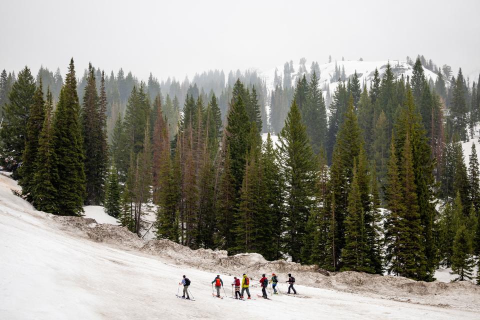 Parker Densmore, left, and friends start a backcountry ski tour at Alta Ski Area, which is closed for the season, on Friday, June 2, 2023. The group was celebrating Densmore’s 200th consecutive day of skiing this season. | Spenser Heaps, Deseret News