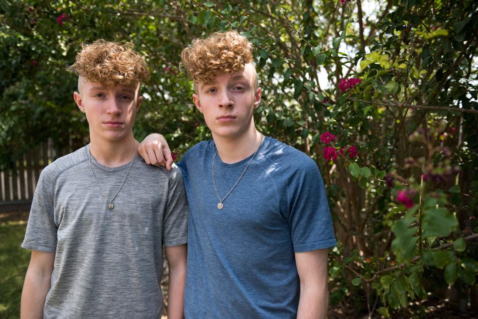 Twins Charlie, left, and Sam at their home in Texas. The brothers allege that celebrity cheerleader, Jerry Harris, solicited them for sex and sexually explicit photos. USA TODAY agreed to withhold their last name because the boys are minors and alleging abuse. 