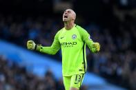 <p>Willy Caballero celebrates as the hosts level </p>