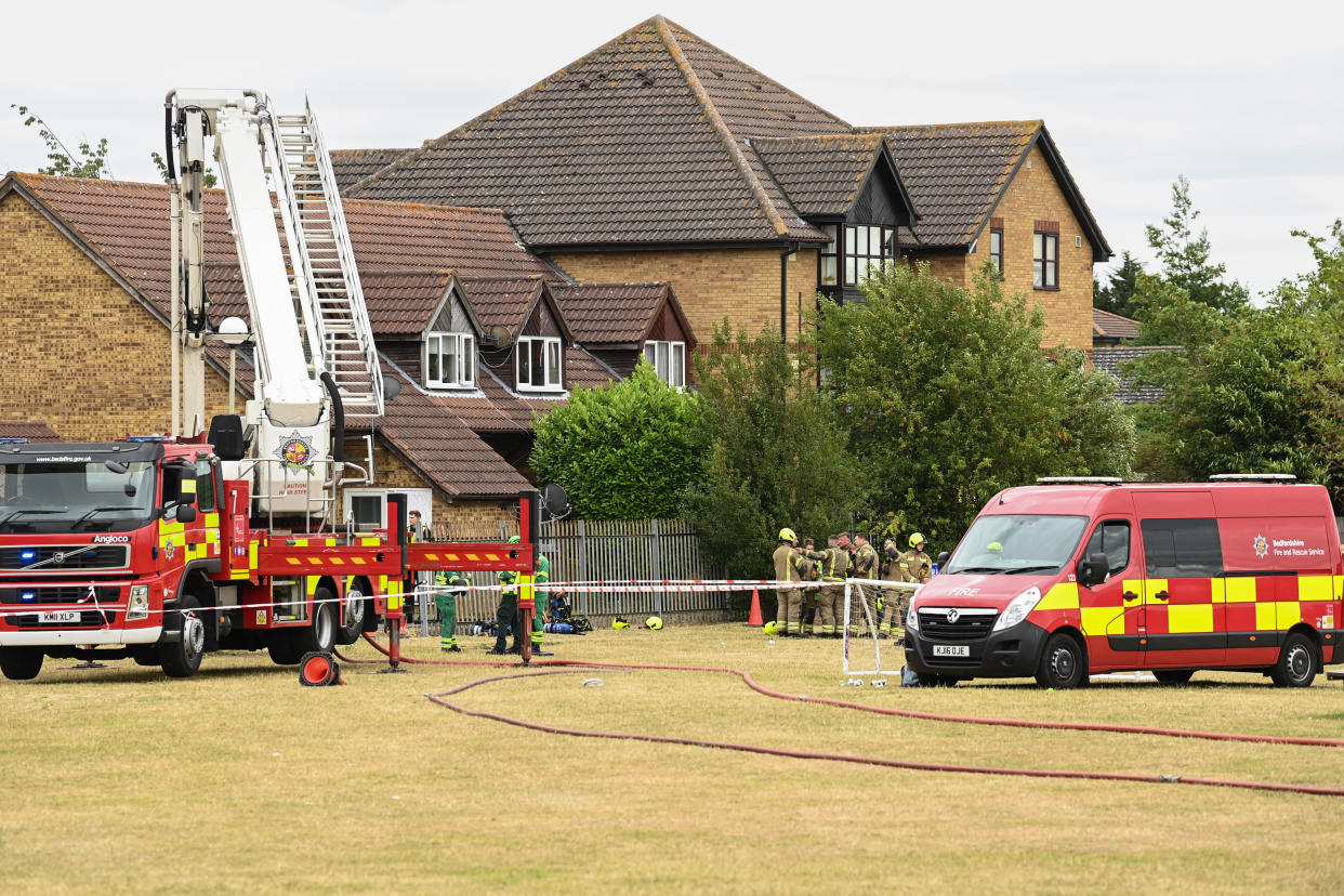 Firefighters at the scene of a gas blast in Redwood Grove, Bedford, where two people were injured, one seriously, after the explosion caused an 