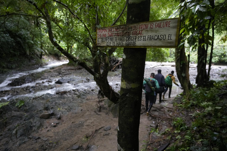 FILE - A sign of encouragement stands on the route used by migrants to cross the Darien Gap, from Colombia into Panama, who hope to reach the U.S., Oct. 15, 2022. (AP Photo/Fernando Vergara, File)