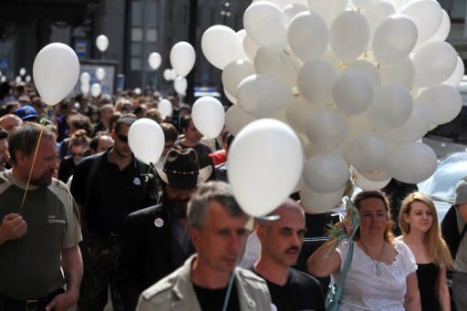 Opposition activists march in Saint-Petersburg on Sunday. The make up of Vladimir Putin's government had been kept under wraps for two weeks in an unusual departure from the earlier practice of instant appointments