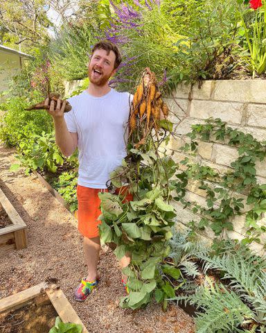 <p>Mark London Instagram</p> Jonathan Van Ness' husband Mark London gardening.