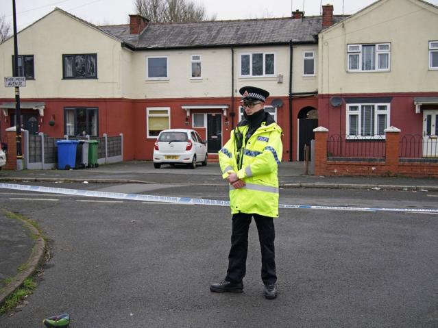 Police at the scene after a 16-year-old boy was fatally stabbed on Thirlmere Avenue in Stretford, Manchester (Peter Byrne/PA)